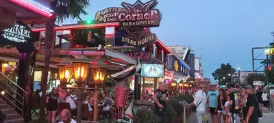 a crowd of people walking down a street at a carnival at Apartmány Rose Residence Nesebar in Sunny Beach