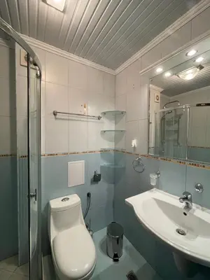 a bathroom with a toilet and a sink at Apart hotel Gallery L in Sunny Beach