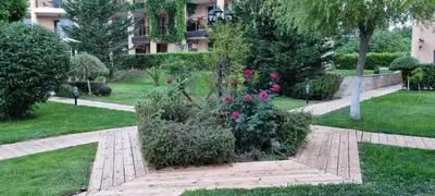 a garden with flowers in the middle of a park at Studio Fresh in Sozopol