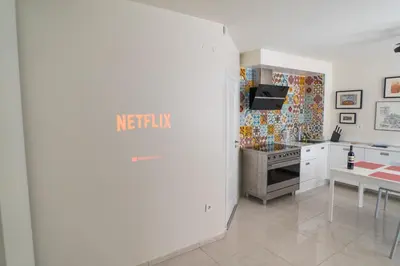 a kitchen with white cabinets and a stove at Sea grape wine flat in old center in Varna City