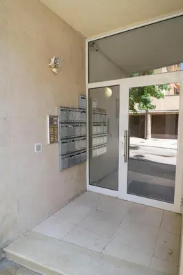 an open door to a building with a glass at Sea grape wine flat in old center in Varna City