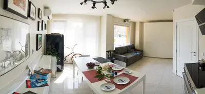 a living room with a table and a couch at Sea grape wine flat in old center in Varna City