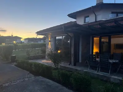 a house with a table and chairs on a patio at Villa Rada, Bay View Villas in Kosharitsa