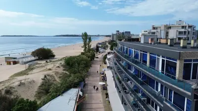 a view of a beach and a building at Apart hotel Gallery Studio in Sunny Beach