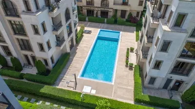 an overhead view of a swimming pool between two buildings at Апарткомплекс Амара Слънчев Бряг Студио 13 in Sunny Beach