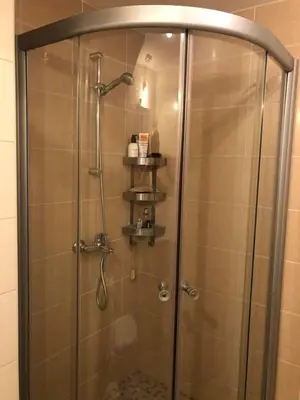 a shower with a glass door in a bathroom at Obzor Beach Resort Beachfront in Obzor