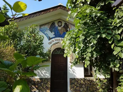 a church with a door with a mosaic above it at Monastery Apartment 14, St. Vlas in Sveti Vlas