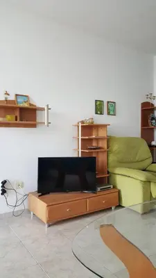 a living room with a couch and a coffee table at Monastery Apartment 14, St. Vlas in Sveti Vlas