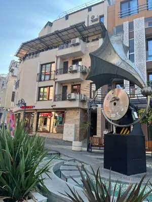 a statue of a fish in front of a building at Studio Marrone on Bogoridi in Burgas City