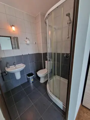 a bathroom with a shower and a toilet and a sink at Апартамент СаMи in Burgas City