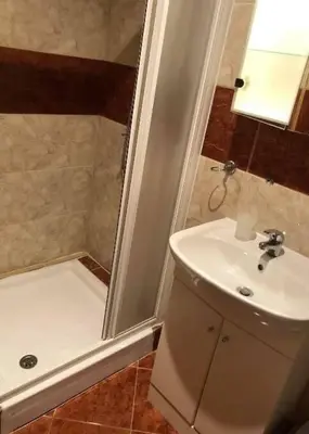 a bathroom with a sink and a shower and a mirror at Cosy, Studio Apartment At Nesebar Fort Club in Sunny Beach
