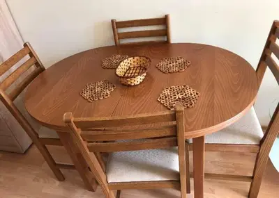a wooden table with four leopard print bowls on it at Cosy, Studio Apartment At Nesebar Fort Club in Sunny Beach