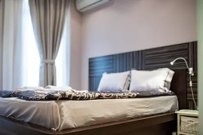 a bedroom with a large bed with a window at Varna Central Ohrid 2bdr Apartment in Varna City