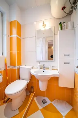 a bathroom with a toilet and a sink at Varna Central Ohrid 2bdr Apartment in Varna City