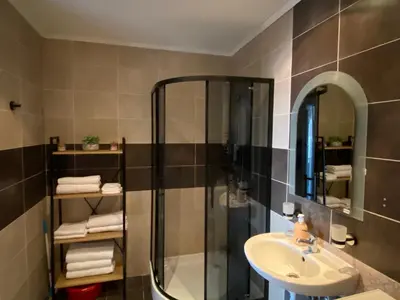 a bathroom with a shower and a sink at Royal Palm Studio with Seaview in Sveti Vlas