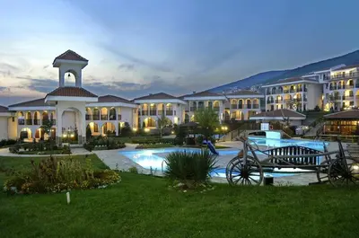 a large building with a pool in front of it at Kambani Arnel Apartment , Marina in Sveti Vlas