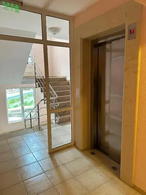 an open door in a room with a staircase at Admiral Plaza Apartment , Large swimming pool , 5 min walking to the beach in Sunny Beach