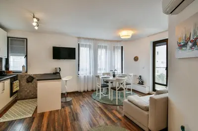 a living room with a kitchen and a dining room at Varna beach flat 1 in Varna City