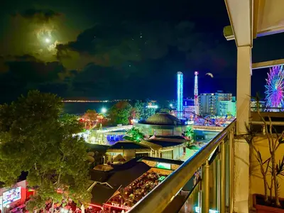 a view of a city at night with lights at Premium Apartment Midia Beach in Sunny Beach