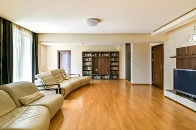 a living room with two couches and a flat screen tv at Central flat with Monster living room in Varna City