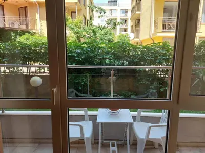 a view of a table and chairs from a window at Святой Влас, комплекс Sea Breeze in Sveti Vlas