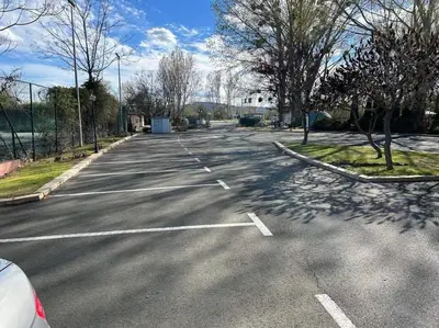 an empty parking lot with a car parked in it at Студио Нели- Созополистайл Клуб in Sozopol