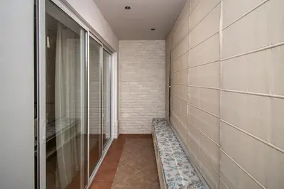 a hallway with a walk in shower and a glass door at Cozy central flat in Varna Downtown in Varna City