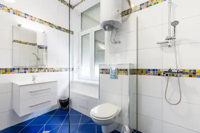 a bathroom with a toilet and a shower and a sink at ПАЦО in Burgas City