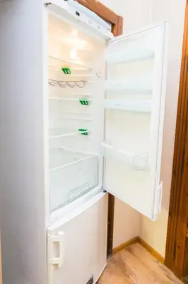 an empty refrigerator with its door open at Summer Square - 2 bedrooms Retro Flat with great location, 1st fl in Burgas City