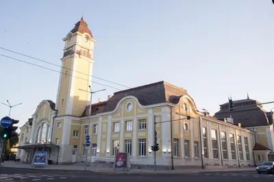 a large building with a clock tower on a street at Summer Square - 2 bedrooms Retro Flat with great location, 1st fl in Burgas City