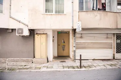 a doorway to a building with a yellow door at Central 3BR with parking nearby Opera in Varna City