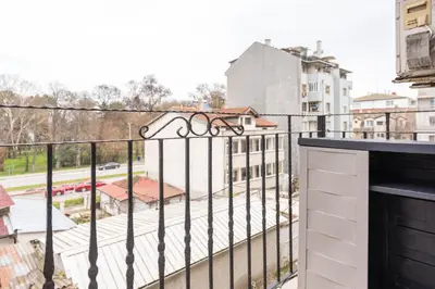 a balcony with a view of a building at Sea&Park Apartment in Varna City