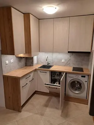 a kitchen with a sink and a washing machine at Sunny place in Sveti Vlas