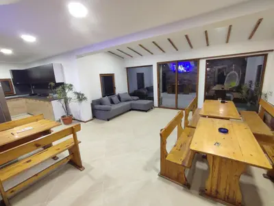 a living room with a table and a couch at Longoz in Bliznatsi