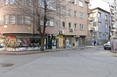 a street corner with a store on the side of a building at Budget 1BR flat downtown Varna in Varna City