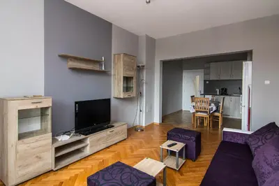 a living room with a couch and a tv at Super Central flat in Varna in Varna City