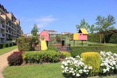 a park with a playground and a play structure at Atia Resort in Chernomorets