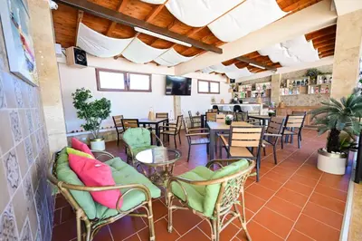 a restaurant with chairs and tables in a room at Kristin Palace in Obzor