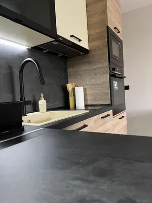 a kitchen with a sink and a microwave at Blue Heaven Apartment Kavaci Sozopol in Sozopol