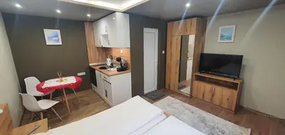 a small room with a kitchen and a living room at KALI GUEST ROOM in Varna City