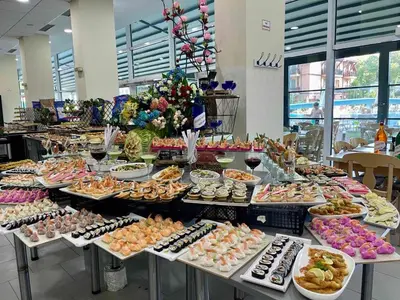 a buffet line with many different types of food at Grand Hotel Nirvana - All Inclusive & Free Beach Access in Sunny Beach