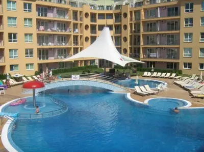 a large swimming pool in front of a large apartment building at Cute Studio Apt, Pollo Resort in Sunny Beach
