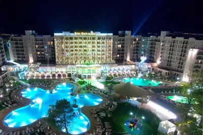 a view of a hotel with pools at night at 2 Bed, Royal Beach Barcelo Hotel in Sunny Beach