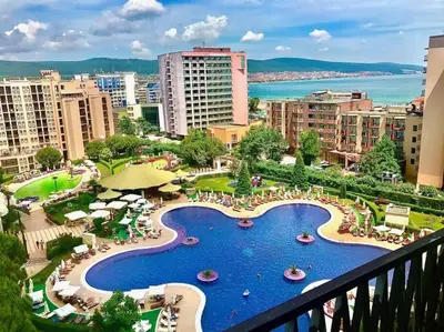 a view from a balcony of a resort with a pool at 2 Bed, Royal Beach Barcelo Hotel in Sunny Beach