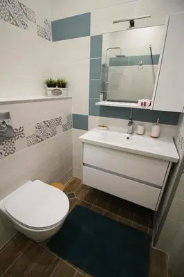 a bathroom with a toilet and a sink and a mirror at Doris Beach studio D09 and studio D10 in Burgas City