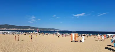 a large group of people on a beach at Апартамент за гости Магнолия Резиденс in Sunny Beach