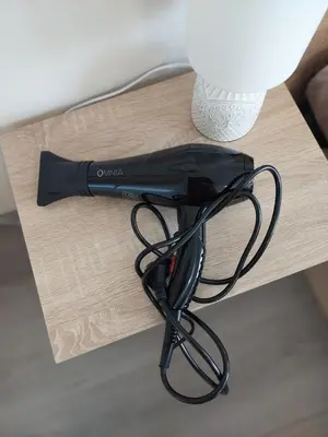 a black flashlight sitting on top of a table at Nereya Studio in Pomorie
