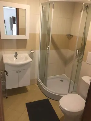 a bathroom with a shower and a sink and a toilet at Spacious, 2 Bed Apt, Fort Orchid in Sunny Beach