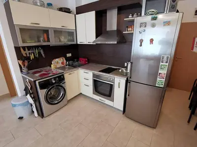 a kitchen with a refrigerator and a washing machine at Homely, 2 Bed Apt, 4* Vineyards in Kableshkovo