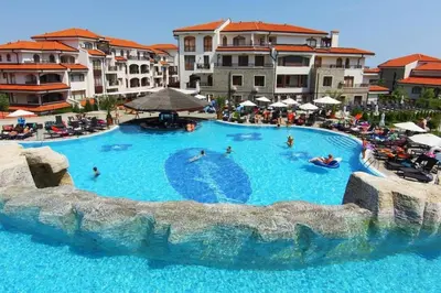 a large swimming pool in a resort with people in it at Homely, 2 Bed Apt, 4* Vineyards in Kableshkovo